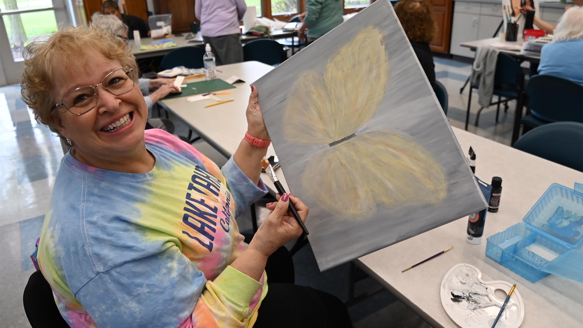 A Woman Shows Her Artwork at the Mentor Senior Center