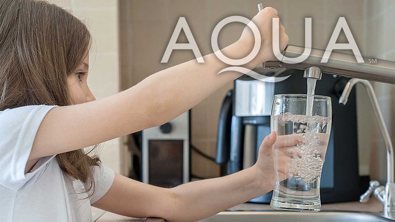 Photo of a person filling a glass with tap water.