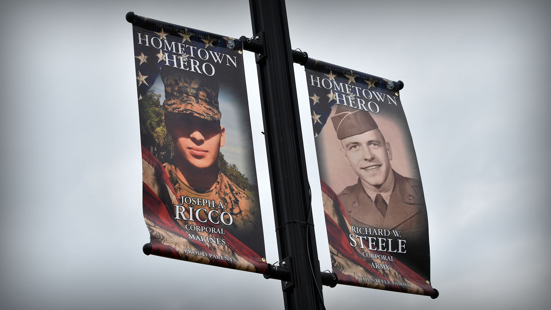 Image of Mentor Hometown Heroes banners hanging on a streetlight.