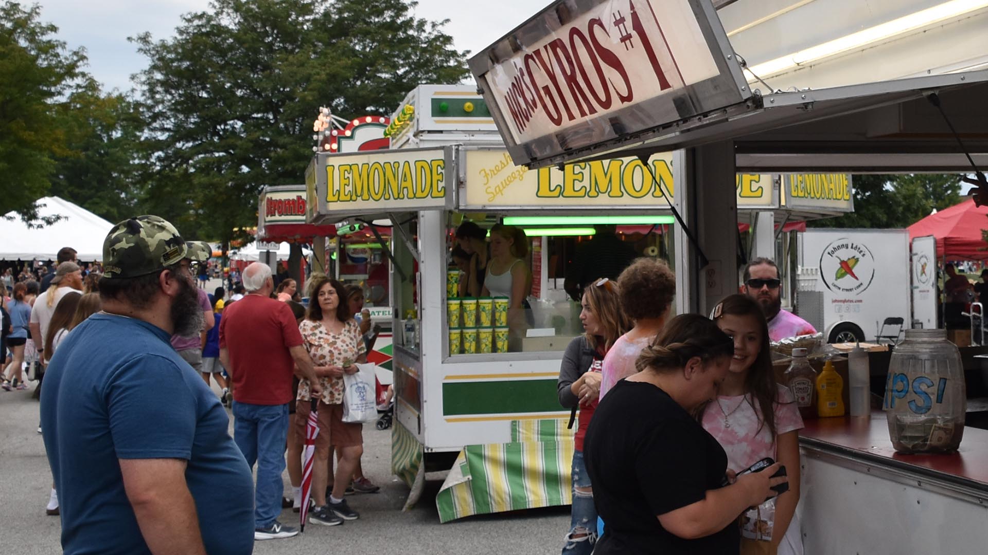 People ordering food at Mentor CityFest.
